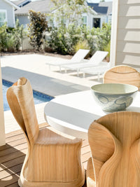 Large light blue sea flower bowl on patio