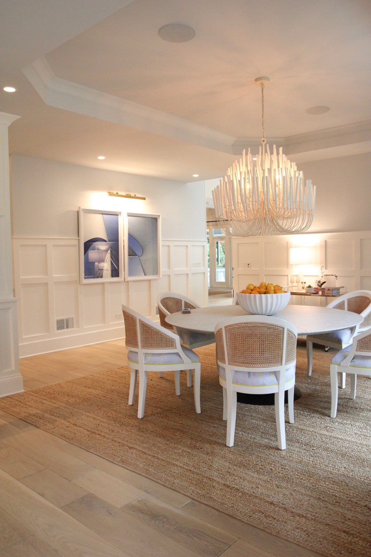 Whitewash stained wood Tilda chandelier in dining room