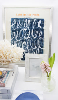 Mother of pearl picture frame on table