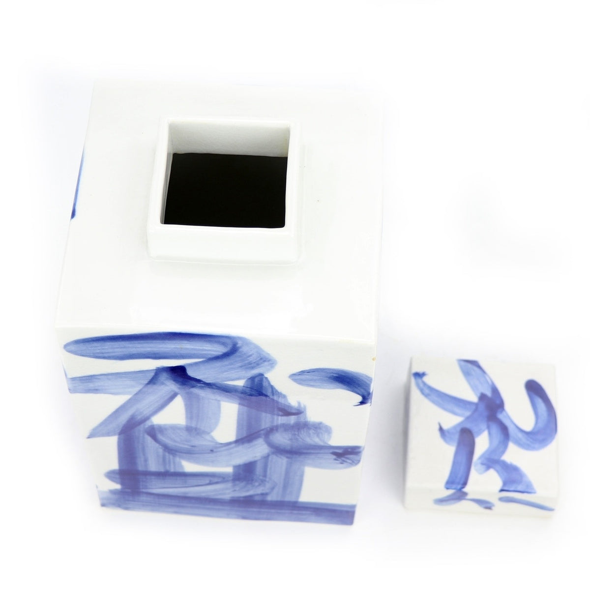 Open blue and white square tea jar