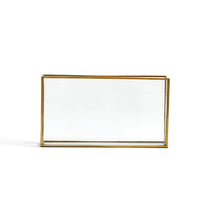 Clear glass rectangular vase with gold metal trim and mirrored base