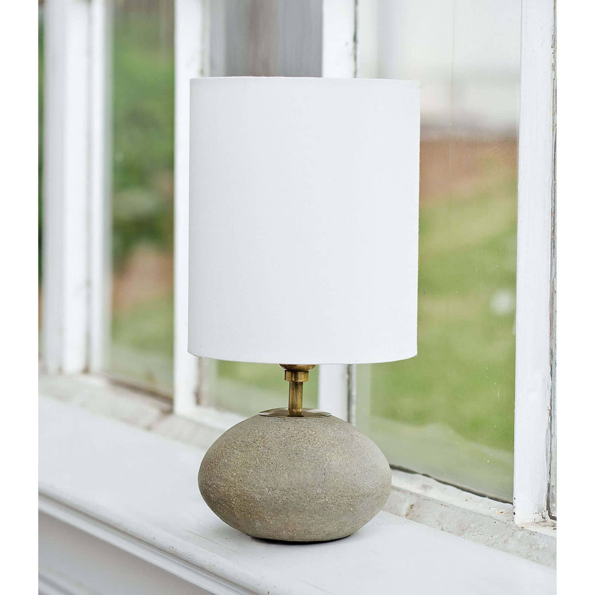 Concrete mini orb lamp on window sill