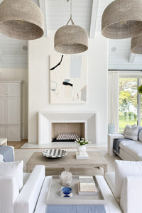 Living room with large pendant lights made of rattan and abaca rope