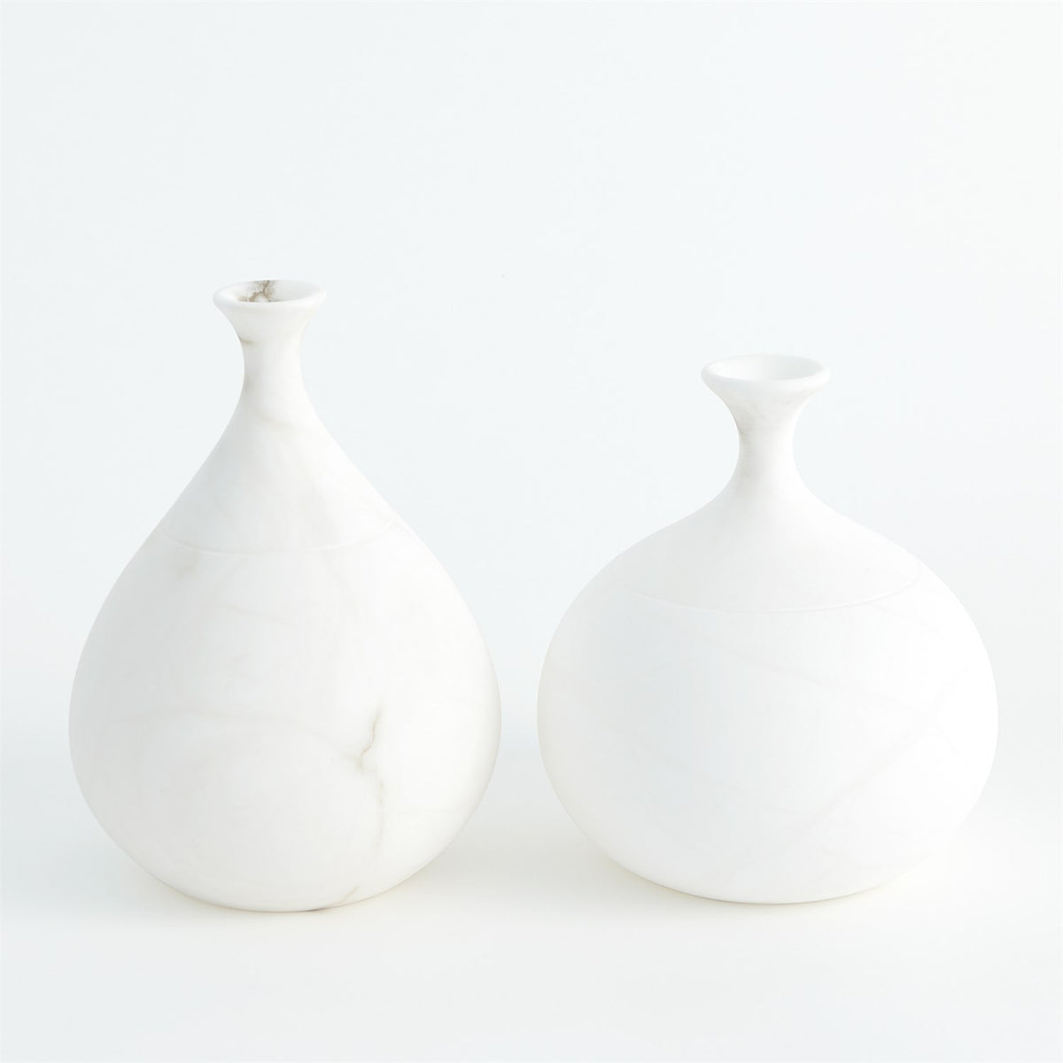Two styles of white alabaster teardrop vases