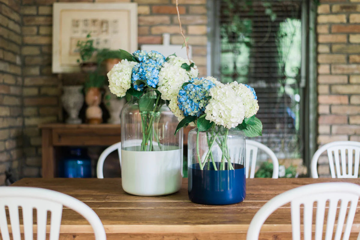 Colorblock jar vases on patio table